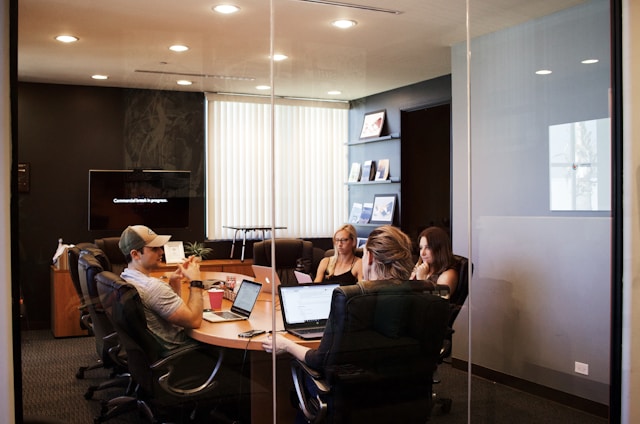 people talking and working