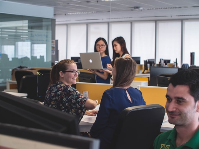 people talking and working
